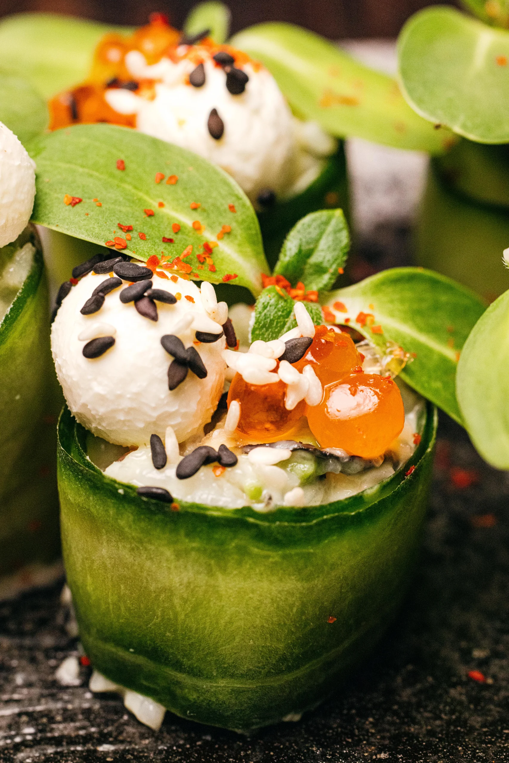 Cucumber rolls with a creamy filling and fresh basil