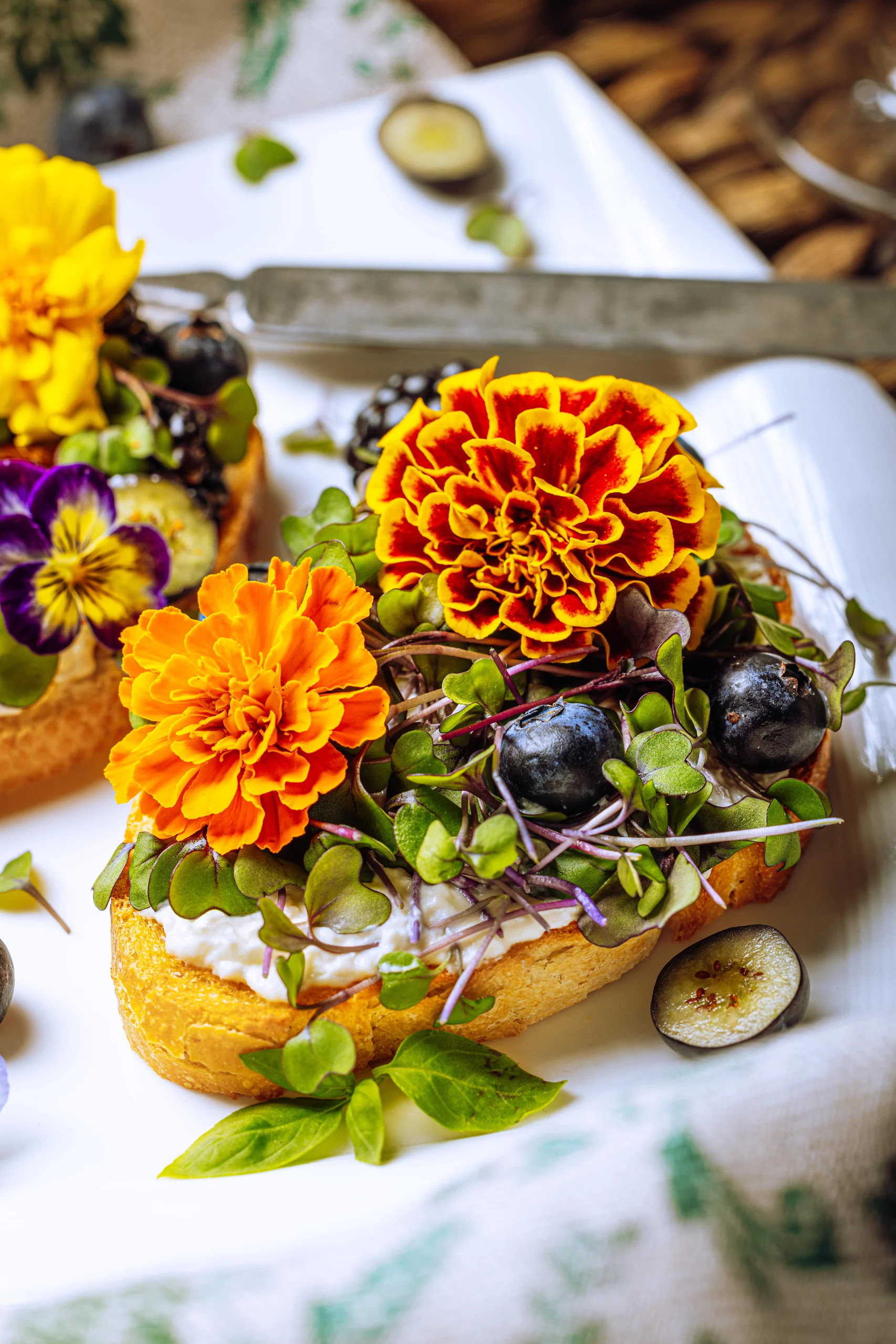 Burrata toast topped with edible flowers